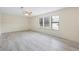 Spacious living room with light-colored wood flooring and large windows at 3032 Ross Rd, Snellville, GA 30039