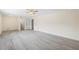 Open concept living room with modern flooring and natural light at 3032 Ross Rd, Snellville, GA 30039
