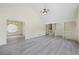 Spacious living room with high ceilings, modern floors, and large windows offering ample natural light at 3032 Ross Rd, Snellville, GA 30039