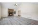 Spacious living room with stone fireplace, large windows, and vaulted ceilings, offering plenty of natural light and openness at 3032 Ross Rd, Snellville, GA 30039