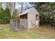 Backyard chicken coop structure with fenced area at 3032 Ross Rd, Snellville, GA 30039