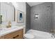 Elegant bathroom featuring modern vanity, patterned tile shower, and sleek fixtures at 4002 Lindsey Dr, Decatur, GA 30035
