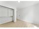 Bedroom includes a closet with custom shelving and a bifold door, adding both functionality and style at 4002 Lindsey Dr, Decatur, GA 30035