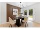 Dining area features modern lighting, natural light, and sleek décor at 4002 Lindsey Dr, Decatur, GA 30035