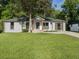 Charming renovated home with fresh white paint, mature landscaping, and inviting front porch at 4002 Lindsey Dr, Decatur, GA 30035