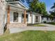 Charming renovated home with fresh paint, covered porch, and mature landscaping at 4002 Lindsey Dr, Decatur, GA 30035