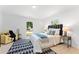Comfortable main bedroom with natural light, stylish rug, and modern furnishings at 4002 Lindsey Dr, Decatur, GA 30035