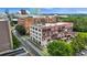 An aerial view showcases the commercial buildings, trees, adjacent street, and surrounding cityscape at 434 Marietta St Nw # 401, Atlanta, GA 30313