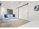 Chic bedroom featuring a barn door, modern art, and comfortable seating area at 434 Marietta St Nw # 401, Atlanta, GA 30313