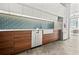 Sleek kitchen with stainless steel appliances, natural wood cabinets, tile backsplash, and a bright, contemporary design at 434 Marietta St Nw # 401, Atlanta, GA 30313