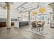 Open-concept kitchen with a large island, stainless steel appliances, and modern pendant lighting over the dining area at 434 Marietta St Nw # 401, Atlanta, GA 30313