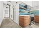 Bright kitchen with stainless steel appliances, custom cabinets, and trendy blue subway tile backsplash at 434 Marietta St Nw # 401, Atlanta, GA 30313