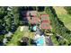 Aerial view of the community tennis courts, playground and pools, perfect for recreation at 1328 Amberwood Dr, Woodstock, GA 30189