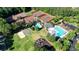 This aerial view showcases the community's tennis courts, playground, and swimming pools at 1328 Amberwood Dr, Woodstock, GA 30189
