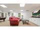 Finished basement with red leather couch, pool table, and built-in cabinets at 1328 Amberwood Dr, Woodstock, GA 30189