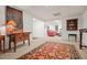Finished basement area with view into adjacent living area with red leather couch at 1328 Amberwood Dr, Woodstock, GA 30189
