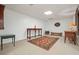Finished basement area featuring a decorative rug, table, and seating at 1328 Amberwood Dr, Woodstock, GA 30189