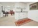 Finished basement with a wet bar, white cabinets, granite countertop, and an adjacent rec area with pool table at 1328 Amberwood Dr, Woodstock, GA 30189