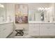 Bathroom with double vanity, neutral colors, and modern lighting at 1328 Amberwood Dr, Woodstock, GA 30189