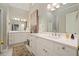Bathroom featuring double vanities, with white cabinets and quartz countertops at 1328 Amberwood Dr, Woodstock, GA 30189