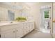 Bathroom with double vanity, white cabinets, and a separate toilet room at 1328 Amberwood Dr, Woodstock, GA 30189