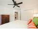 Bedroom features white walls, neutral carpet, a ceiling fan and a large window at 1328 Amberwood Dr, Woodstock, GA 30189