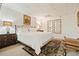Bedroom with white bedding, wall art, and carpeted floor at 1328 Amberwood Dr, Woodstock, GA 30189