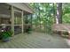 Cozy deck with a bench seating and a view of the natural landscaping at 1328 Amberwood Dr, Woodstock, GA 30189