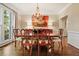 Charming dining room with elegant chandelier and hardwood flooring at 1328 Amberwood Dr, Woodstock, GA 30189