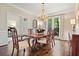 Formal dining room with a chandelier, hardwood floors, and classic furnishings at 1328 Amberwood Dr, Woodstock, GA 30189