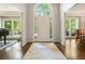 Elegant foyer with hardwood floors, a large arched window, and sophisticated decor at 1328 Amberwood Dr, Woodstock, GA 30189