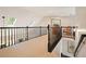 Upstairs hallway with carpet, railing, skylights, chair and art at 1328 Amberwood Dr, Woodstock, GA 30189