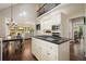Bright kitchen with granite counters, stainless appliances, and eat-in dining area at 1328 Amberwood Dr, Woodstock, GA 30189