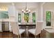 Well-lit eat-in kitchen with stainless steel appliances and a view to the backyard at 1328 Amberwood Dr, Woodstock, GA 30189