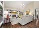 Bright living room showcasing a fireplace, built-in shelving, and hardwood floors at 1328 Amberwood Dr, Woodstock, GA 30189