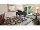 Sophisticated living room features a grand piano and elegant decor at 1328 Amberwood Dr, Woodstock, GA 30189