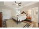 Main bedroom with ensuite bathroom and dual closets and dark wood flooring at 1328 Amberwood Dr, Woodstock, GA 30189