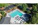 Aerial view of a large community pool and sundeck with lounge chairs at 1328 Amberwood Dr, Woodstock, GA 30189