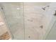Walk-in shower with glass enclosure, gray tile walls and floor, and chrome fixtures at 1328 Amberwood Dr, Woodstock, GA 30189