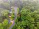 Aerial view of a neighborhood with mature trees and winding roads at 1822 Oriole Trl, Lithia Springs, GA 30122