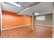 The unfinished basement features laminate flooring, painted walls, and exposed duct work at 1822 Oriole Trl, Lithia Springs, GA 30122