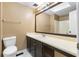 This bathroom has dark cabinets, a large mirror, and a shower/tub combo at 1822 Oriole Trl, Lithia Springs, GA 30122
