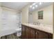Clean bathroom with light walls, a shower-tub combo and modern vanity at 1822 Oriole Trl, Lithia Springs, GA 30122