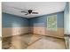 Empty bedroom with carpet, half painted walls and a ceiling fan at 1822 Oriole Trl, Lithia Springs, GA 30122