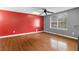 Bedroom with wood floors, a ceiling fan and multiple windows for natural light at 1822 Oriole Trl, Lithia Springs, GA 30122
