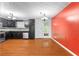 Kitchen featuring wood floors, stainless steel appliances, granite countertops and black cabinets at 1822 Oriole Trl, Lithia Springs, GA 30122