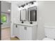 Bathroom featuring a double vanity, modern fixtures, and a toilet at 4212 Bryan Se Dr, Acworth, GA 30102