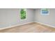 Bright bedroom featuring two windows that offer a view of the beautiful foliage at 4212 Bryan Se Dr, Acworth, GA 30102