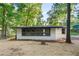 Cozy home with a bright exterior and a charming front porch at 4212 Bryan Se Dr, Acworth, GA 30102