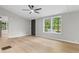 Bright and airy main bedroom features light wood floors and a ceiling fan; a door opens to the outside at 4212 Bryan Se Dr, Acworth, GA 30102